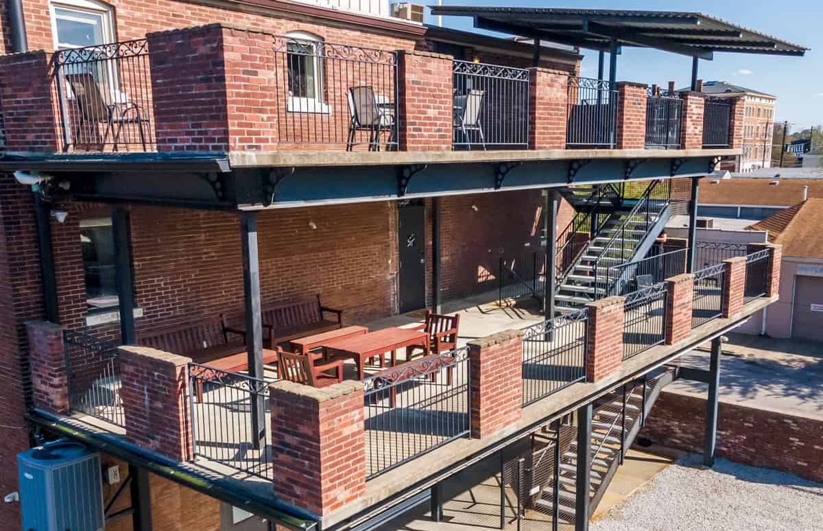 Rear outdoor decks and lounge and dining area at the rear of the Swepson Guesthouse in Louisville Kentucky